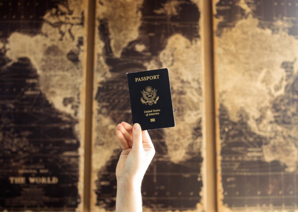 Passport in front of World Map